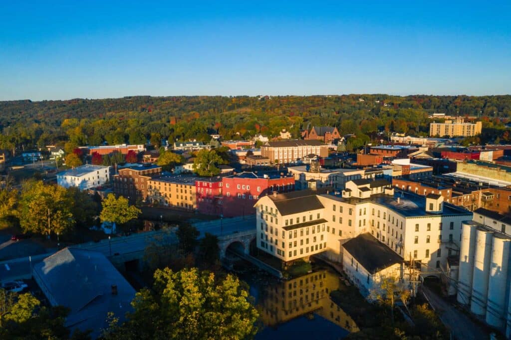Aerial view of downtown Penn Yan, NY lit by golden hour sun